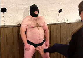 Femdom. Ballbusting while he stands and endures submissively