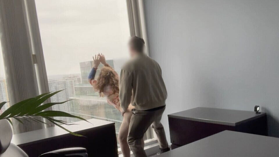 MILF boss fucked against office window