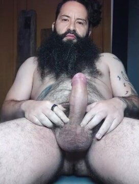 Bearded and hairy guy playing alone with his dick