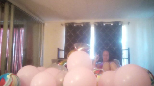 Milf with extreme long hair popping balloons smoking cigarettes while filming skirt