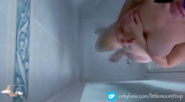 Busty beauty masturbates shower