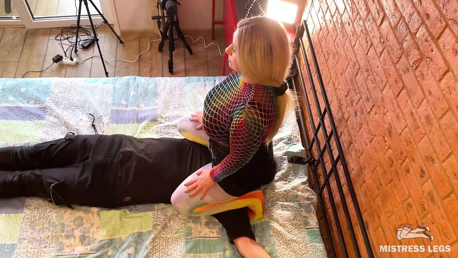 Mistress sitting bouncing with nylon slave face