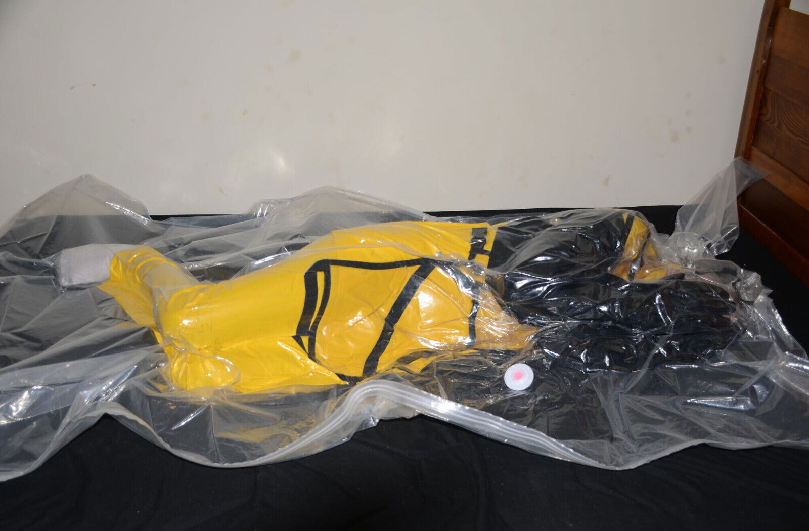 VacPacked yellow Carhartt raingear with heavy rubber gloves aprons face shield
