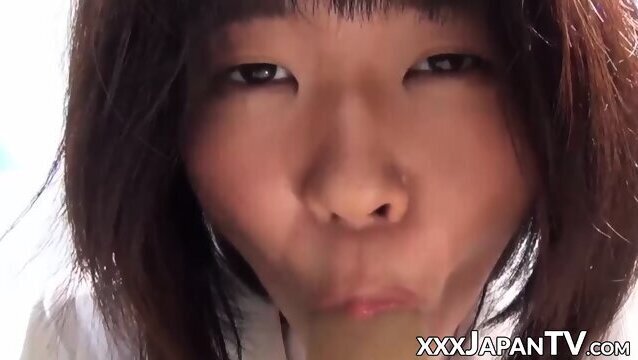 Young Japanese school girl sucking and riding dildo outdoor