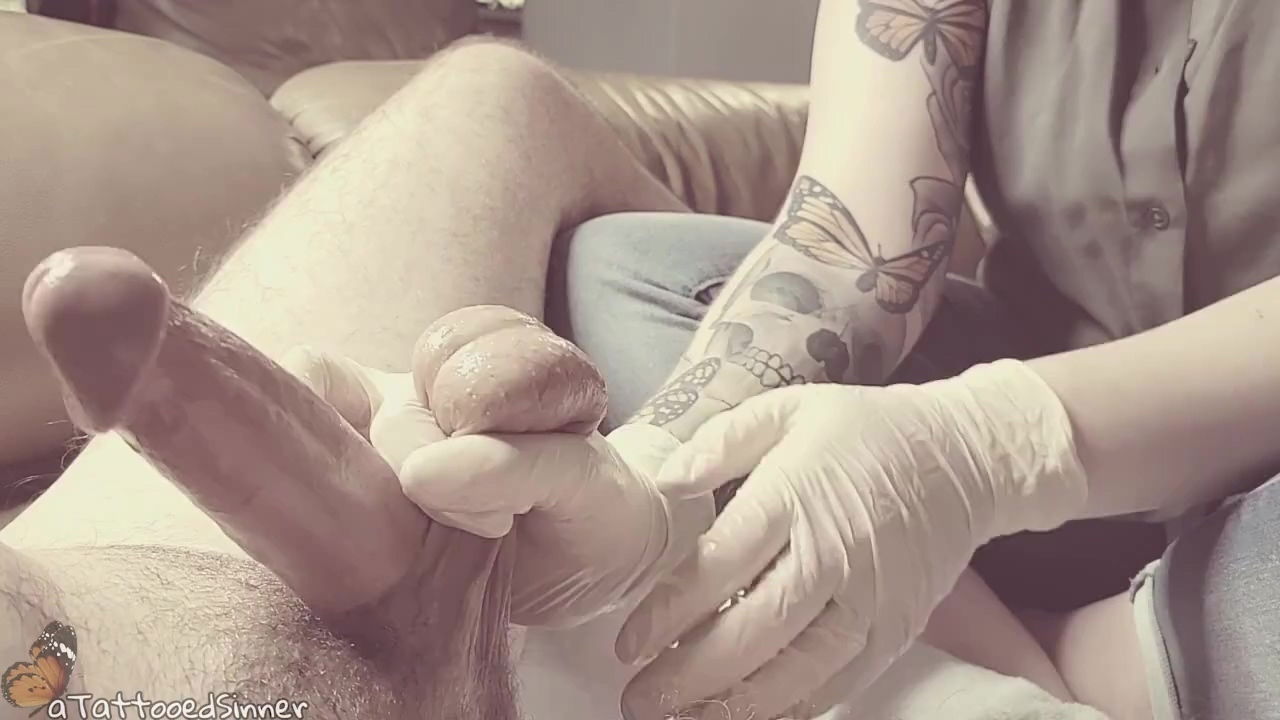 Tattooed Girl jerks boyfriend's hard with latex gloves