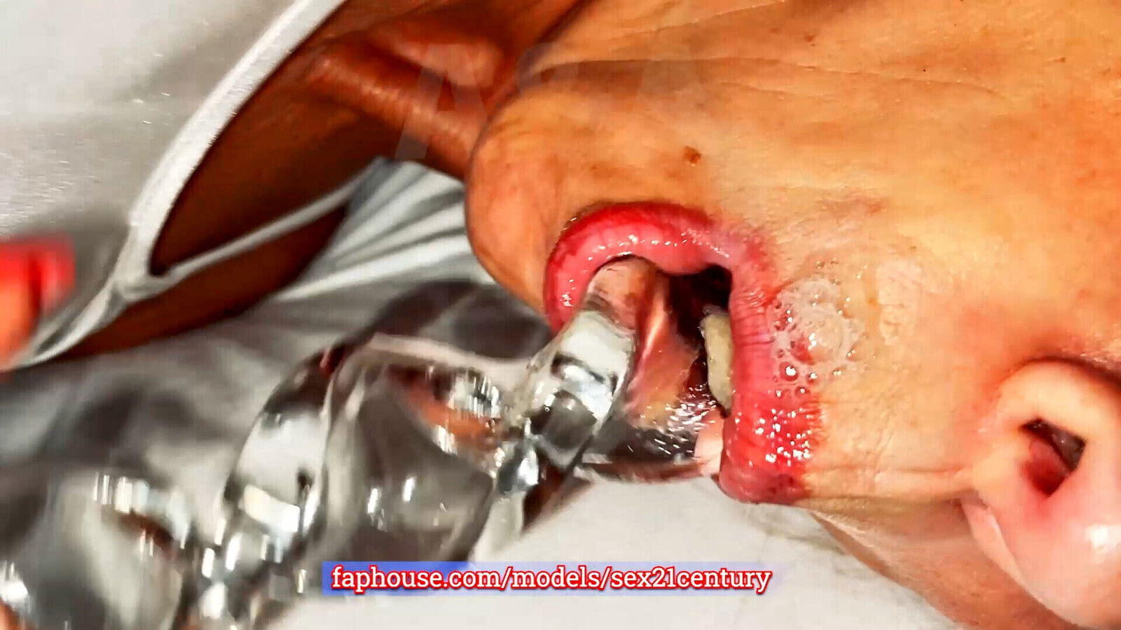 Blonde playing with exotic glass toy. Stretches cums