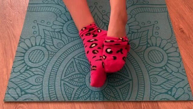 Step sister doing yoga fitness room