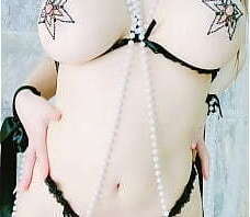 Sexy asian girl play with her tits and feet