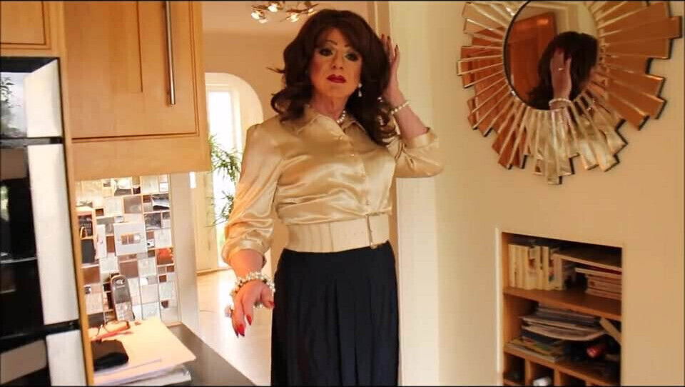 Gold blouse blue pleated skirt