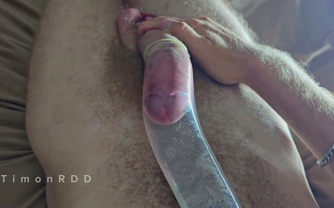 Horny shoots huge loads condom filled with scorching water
