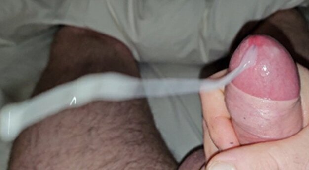 dick wanked strong, long cumshot (almost camera)