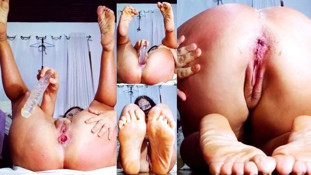 Foot worship with transparent dildo
