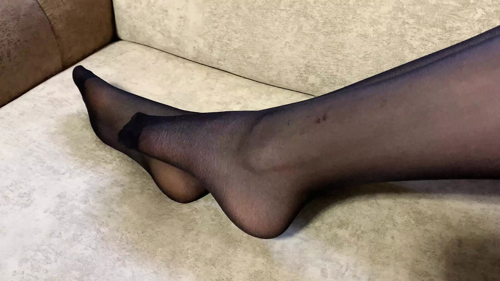 Girl black nylon tights caresses long legs