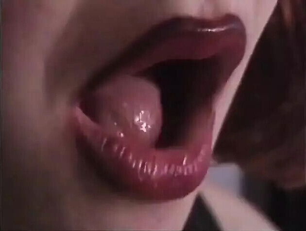 Round-assed leather BDSM hottie whips kneeling white slave guy's balls