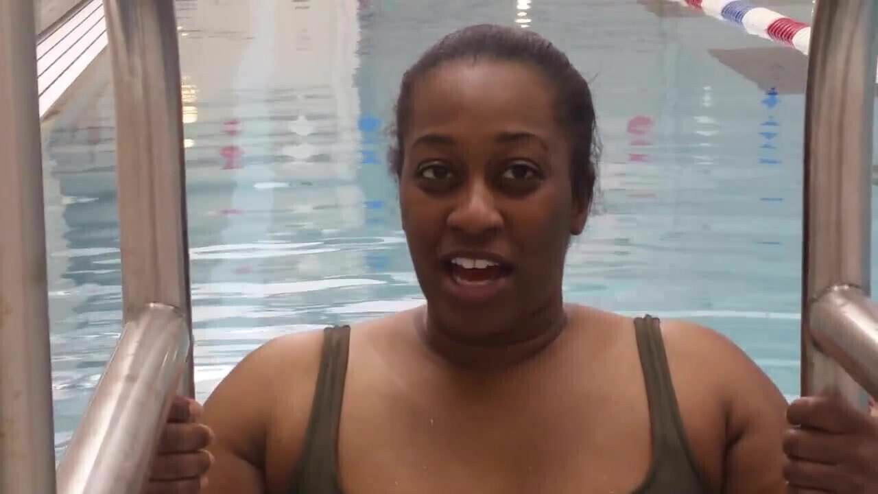 BBW Black woman put a pink latex swimcap