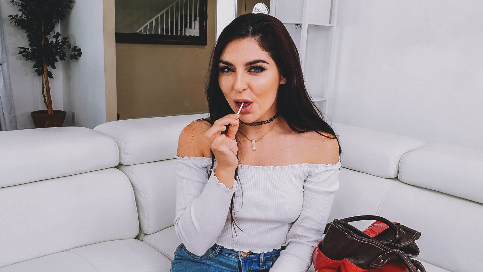 Dark-haired seductress fucks herself with dildo