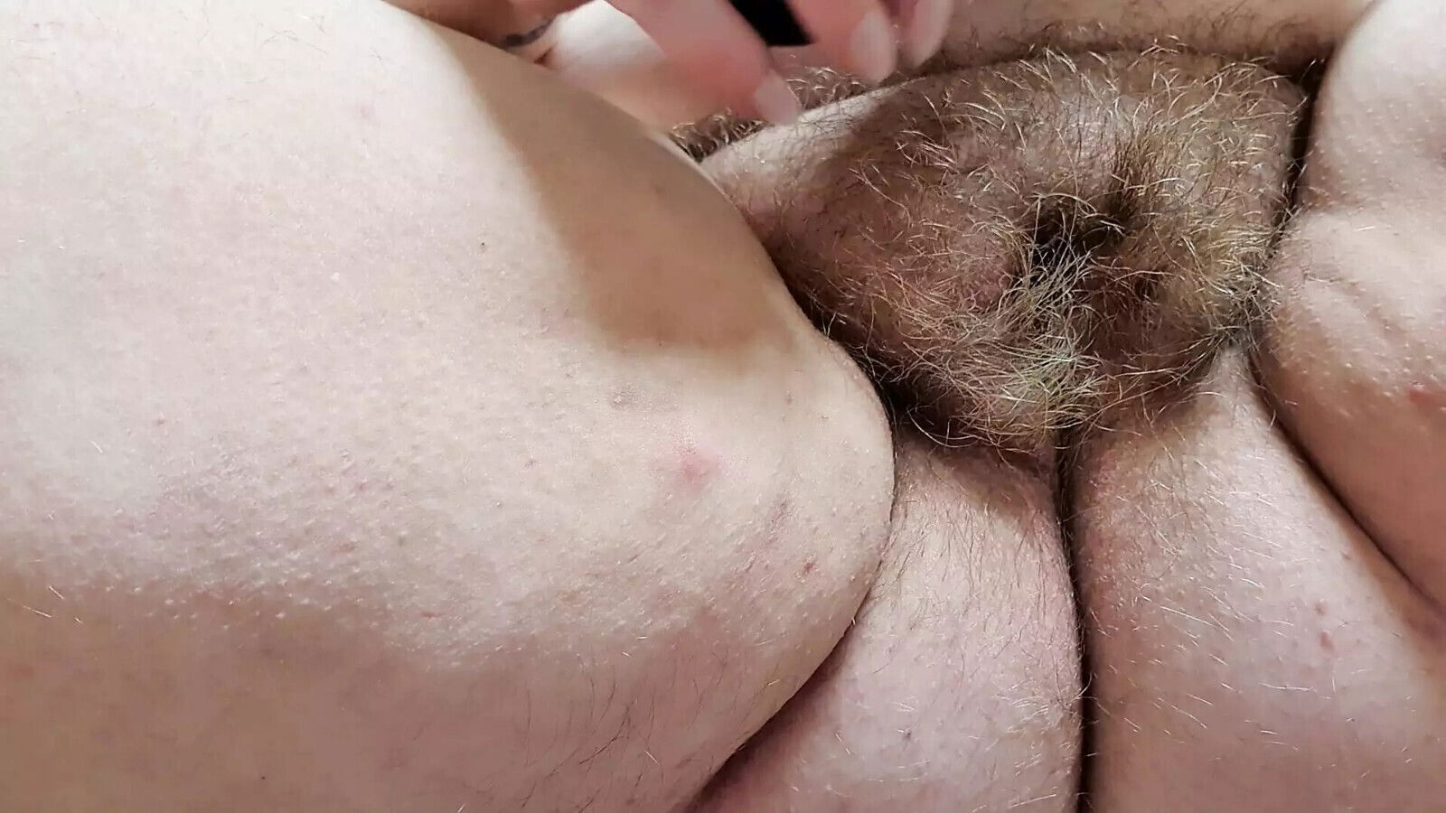 playing with spread hairy pussy dildo