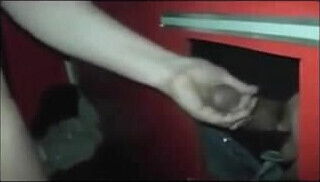 Mature swingers sucking and fucking in the Glory Hole booth