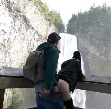 Fucking outdoors in front of a public waterfall