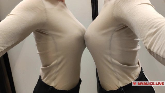 haul sweaters fitting room. beauty pulls clothes. Upskirt view during fitt