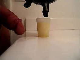 Dumping a huge load of thick cum from a 56l bra cup