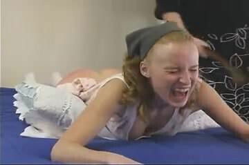 young girl strapped face forward