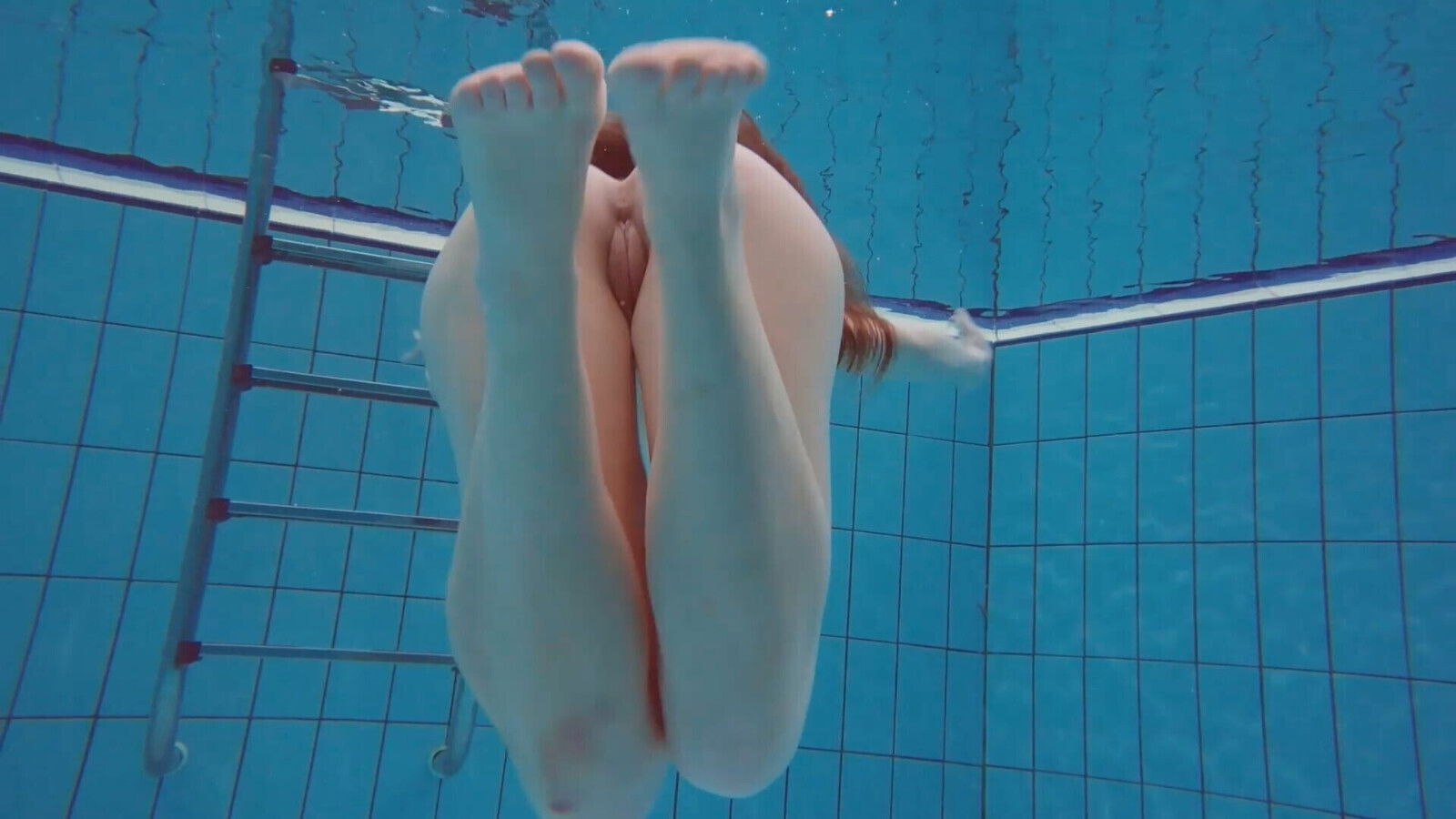 Pretty Polish teen Alice swimming without clothes