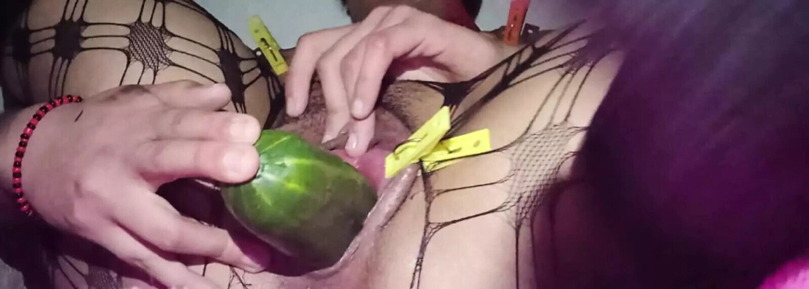 Stretched vaginal lips inserting cucumber squirting