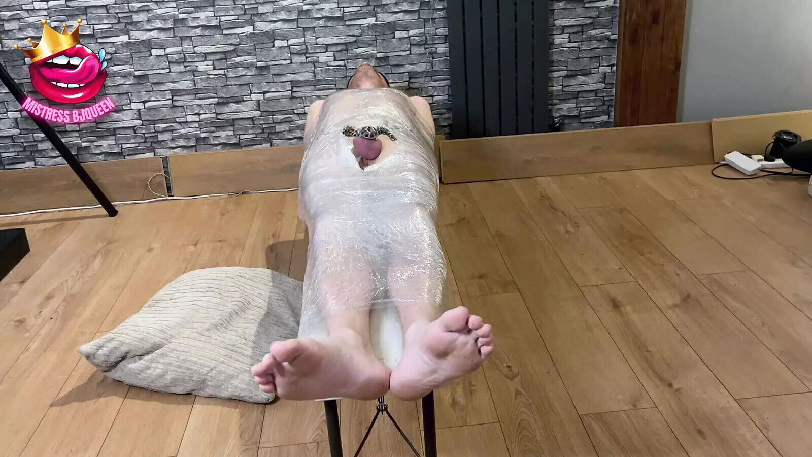 Mummified slave expecting handjob, locked chastity cage instead