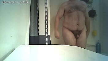NUDE Man in bathroom on hidden camera.