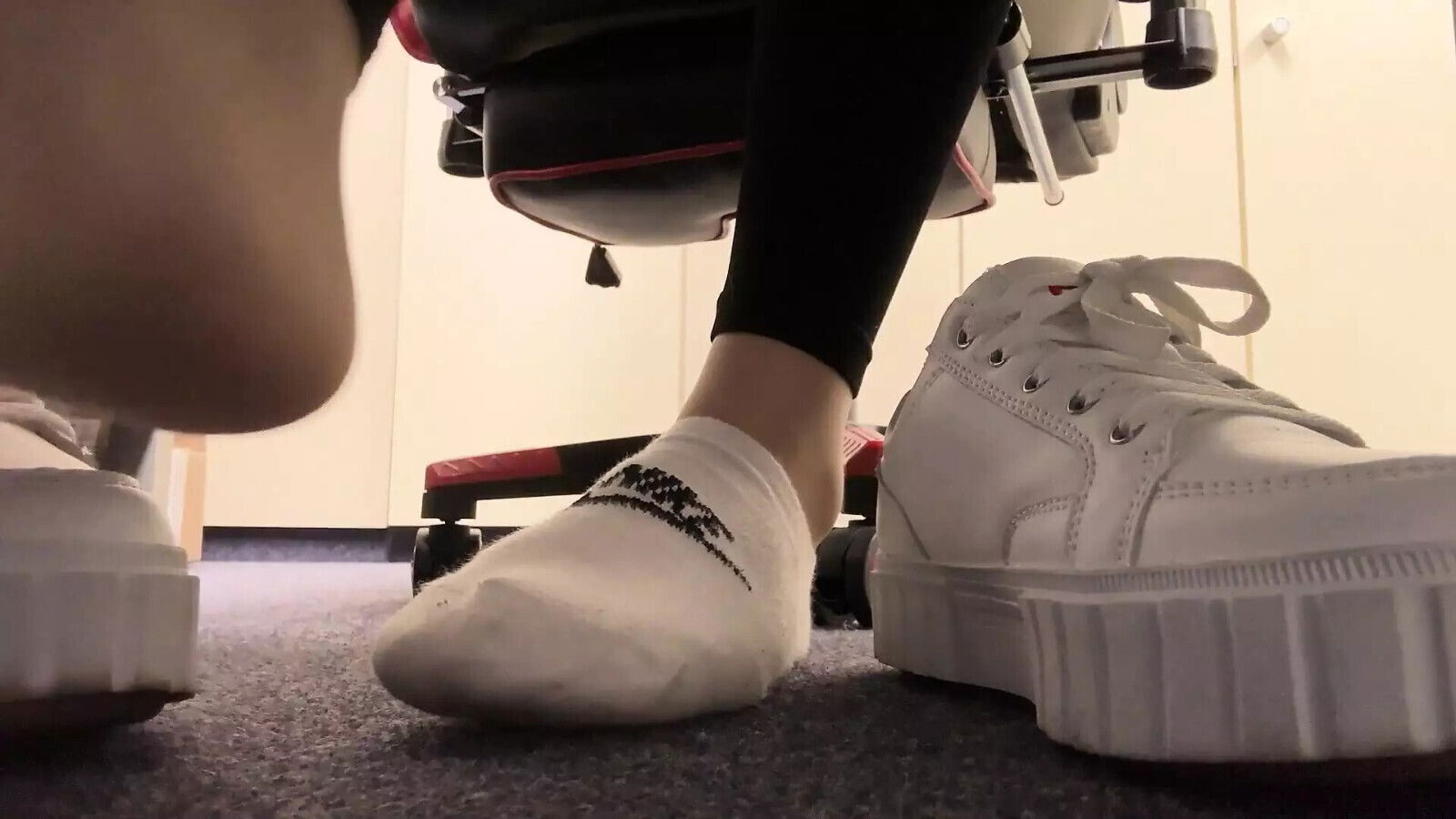 Showing socks feet while working